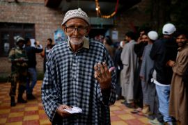 A man shows his ink-stained finger after voting at a polling station, during the fourth general election phase, in south Kashmir&#039;s Pulwama district [Sharafat Ali/Reuters]