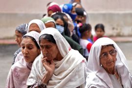 Women wait to cast their votes at a polling station during the fourth phase of India&#039;s general election in Srinagar [Sanna Irshad Mattoo/Reuters]