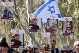 Protesters hold portraits of captives Gadi Moses, Itay Chen, Nadav Popplewell and Tal Shoham [File: Jack Guez/AFP]