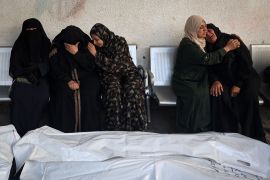 Relatives of Palestinians killed in Israeli bombing mourn near their remains at Al-Najjar Hospital in Rafah in the southern Gaza Strip on May 3, 2024 [AFP]