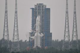 This picture shows a Long March 5 rocket, carrying the Chang&#039;e-6 mission lunar probe, at the Wenchang Space Launch Centre in southern China&#039;s Hainan Province on May 3, 2024. - China is set on May 3 to launch a probe to collect samples from the far side of the Moon, a world first as Beijing pushes ahead with an ambitious programme that aims to send a crewed lunar mission by 2030. (Photo by HECTOR RETAMAL / AFP) (AFP)