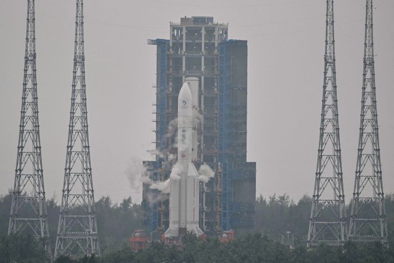 This picture shows a Long March 5 rocket, carrying the Chang'e-6 mission lunar probe, at the Wenchang Space Launch Centre in southern China's Hainan Province on May 3, 2024. China is set on May 3 to launch a probe to collect samples from the far side of the Moon, a world first as Beijing pushes ahead with an ambitious programme that aims to send a crewed lunar mission by 2030. (Photo by HECTOR RETAMAL / AFP)