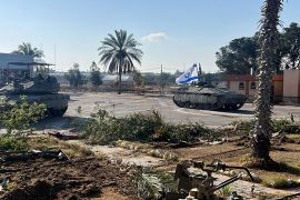 Israeli tanks entering the Palestinian side of the Rafah border crossing between Gaza and Egypt on May 7, 2024 [Israeli army via AFP]