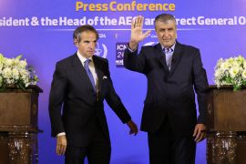 Iran&#039;s Mohammad Eslami greets IAEA chief Rafael Grossi before their joint news conference in Isfahan [Atta Kenare/AFP]