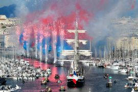 Fireworks go off as the French 19th-century three-masted barque Belem (C) arrives at the Vieux-Port (Old Port) during the Olympic Flame arrival ceremony, ahead of the Paris 2024 Olympic and Paralympic Games, in Marseille, France. The transfer of the flame onshore from a 19th-century tall ship marked the start of a 12,000km (7,500-mile) torch relay across mainland France and the country&#039;s far-flung overseas territories. [Sylvain Thomas/AFP]