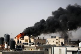 Thick, black smoke rises from a fire in a building caused by Israeli bombardment in Rafah in the southern Gaza Strip on May 10, 2024 [AFP]