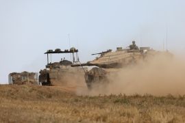 Israeli military vehicles roll near the boundary with the Gaza Strip on May 12, 2024 amid the ongoing Israeli offensive in Gaza&#039;s north [Menahem Kahana/AFP]