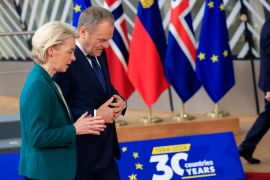 Polish Prime Minister Donald Tusk speaks with European Commission President Ursula von der Leyen on the sidelines of an EU summit in Brussels on March 22, 2024 [File: Geert Vanden Wijngaert/AP]