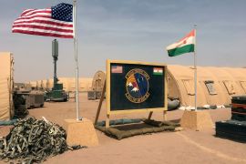 The US and Niger flags side by side at a base camp for air force and other personnel supporting the construction of Airbase 201 in Agadez, Niger, in 2018 [File: Carley Petesch/AP Photo]