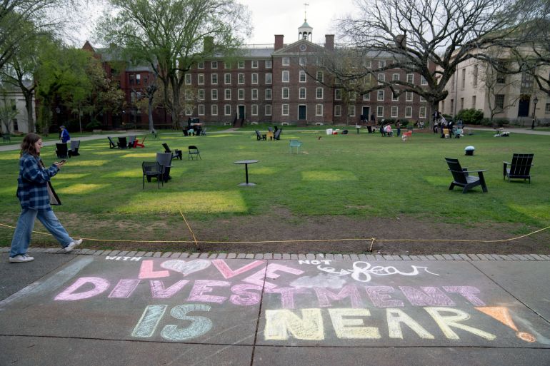 A message in chalk decorates a sidewalk after an encampment protesting the Israel-Hamas war was taken down at Brown University,