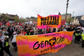 Protesters hold a banner with the words in Swedish &quot;No To Genocide&quot; during a Pro-Palestinian demonstration against Israel&#039;s participation in the Eurovision singing competition in Malmo, Sweden, on Thursday, May 9, 2024 [Martin Meissner/AP Photo]