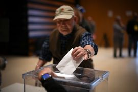 An early voter casts his ballot for Catalonia&#039;s regional elections in La Roca del Valles, north of Barcelona [Emilio Morenatti/AP]