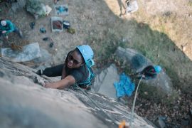 Shalom Maholo, 22, pictured creating a climbing route, is one of a small group of Malawians who want to turn their country into a destination of choice for climbers and encourage a new generation of Malawian climbers, too. &#039;We&rsquo;re women, and society thinks that we cannot do it, but we need to take these barriers out,&#039; she says. [Kiran Kallur/Al Jazeera]