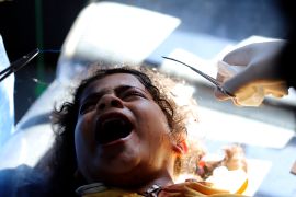 Palestinian medics treat a girl wounded in Israeli bombardment at the Kuwaiti Hospital in Rafah [Ramez Habboub/AP]