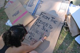 A protester at Tulane University&#039;s solidarity encampment makes a sign supporting Palestine [Delaney Nolan/Al Jazeera]